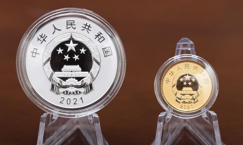 Photo taken on Oct. 9, 2021 shows the obverse of the commemorative coins to celebrate the 2020 UN Biodiversity Conference, in Beijing, capital of China. China's central bank is set to issue a set of commemorative coins on Oct. 11, 2021 to celebrate the 2020 UN Biodiversity Conference. The commemorative set contains one gold coin and one silver coin.Photo:Xinhua