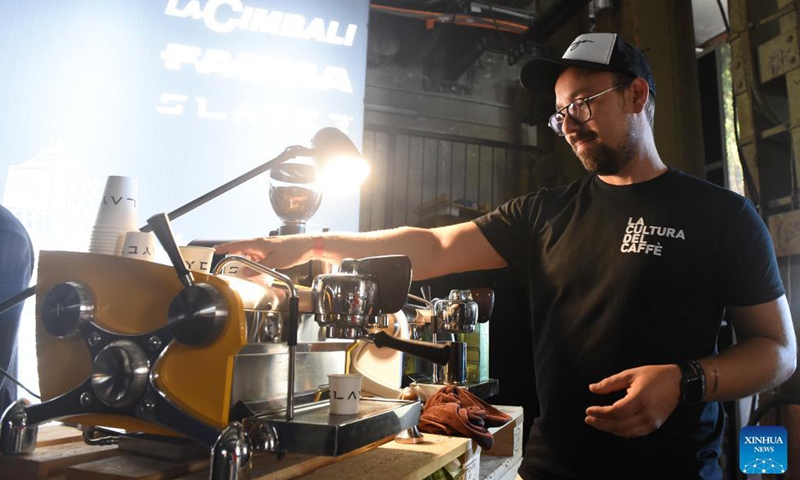 A barista prepares coffee for visitors during the 2021 Vienna Coffee Festival in Vienna, Austria, on Oct. 8, 2021. The 2021 Vienna Coffee Festival is held here in the Ottakringer Brewery from Oct. 8 to Oct. 10, attracting over 60 exhibitors from all over the world.Photo:Xinhua