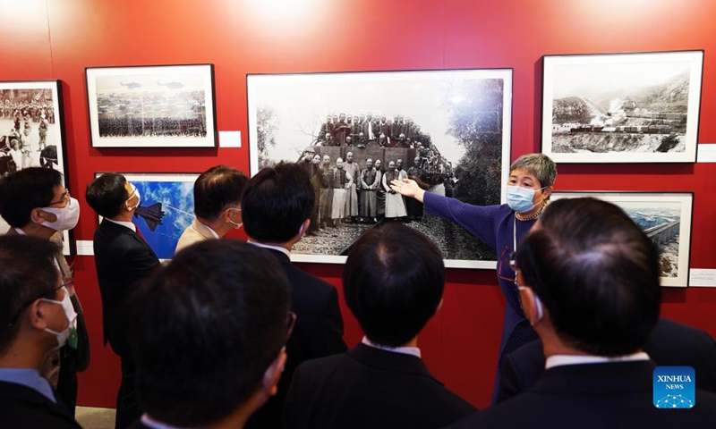 Guests visit a photo exhibition at Hong Kong Central Library in Hong Kong, south China, Oct. 8, 2021. A photo exhibition that opened Friday in Hong Kong showcased the unfading blood ties between Hong Kong and the motherland over the past 100 years, as well as the great achievements of China.Photo:Xinhua
