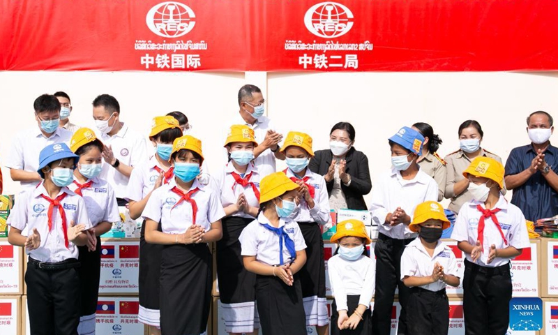 The China-Laos railway engineering companies, including the China Railway International Group (CRIG) and the China Railway No.2 Engineering Group (CREC-2), hand over donated sports facilities and anti-epidemic supplies to the China-Laos Friendship Nongping Primary School in Vientiane, Laos, Oct. 8, 2021.Photo:Xinhua