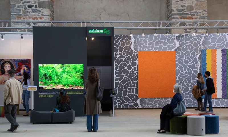 People visit the Contemporary Istanbul art fair in Istanbul,Turkey, on Oct. 8, 2021. Contemporary Istanbul, Turkey's leading art fair, hosted the 16th edition at its new venue, an ancient shipyard, amid the COVID-19 pandemic. The event, which kicked off on Tuesday, will run until Oct. 10. Photo:Xinhua