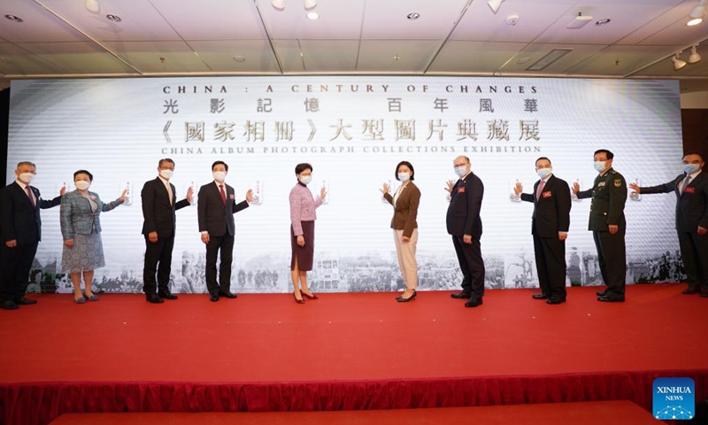 Guests attend the opening ceremony of a photo exhibition at Hong Kong Central Library in Hong Kong, south China, Oct. 8, 2021. A photo exhibition that opened Friday in Hong Kong showcased the unfading blood ties between Hong Kong and the motherland over the past 100 years, as well as the great achievements of China.Photo:Xinhua