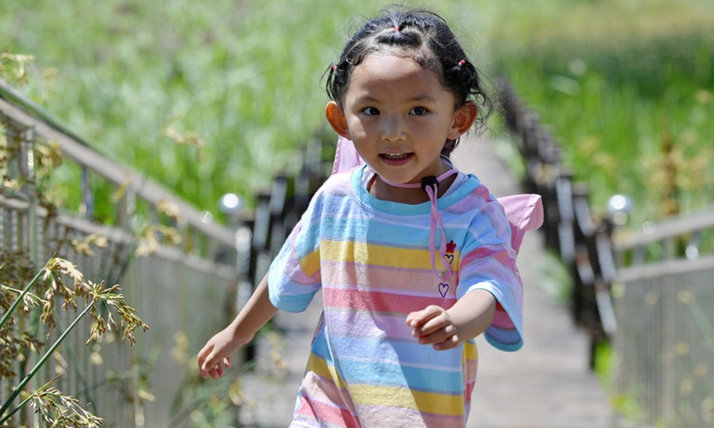 A child visits the Lhalu wetland national nature reserve in Lhasa, southwest China's Tibet Autonomous Region, July 17, 2021. (Photo: Xinhua)