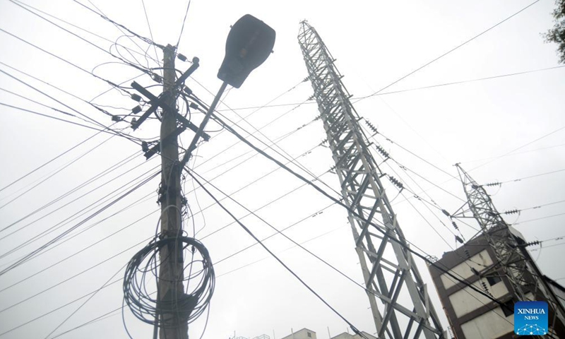 High voltage power lines are pictured in Bangalore, India, Oct. 15, 2021. In the face of diminishing power generation in Karnataka due to a shortage of coal, the Bangalore administration has decided to impose power cuts in several parts of the city.Photo:Xinhua