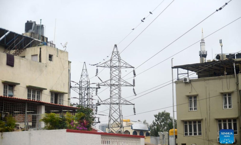 High voltage power lines are pictured in Bangalore, India, Oct. 15, 2021. In the face of diminishing power generation in Karnataka due to a shortage of coal, the Bangalore administration has decided to impose power cuts in several parts of the city.Photo:Xinhua