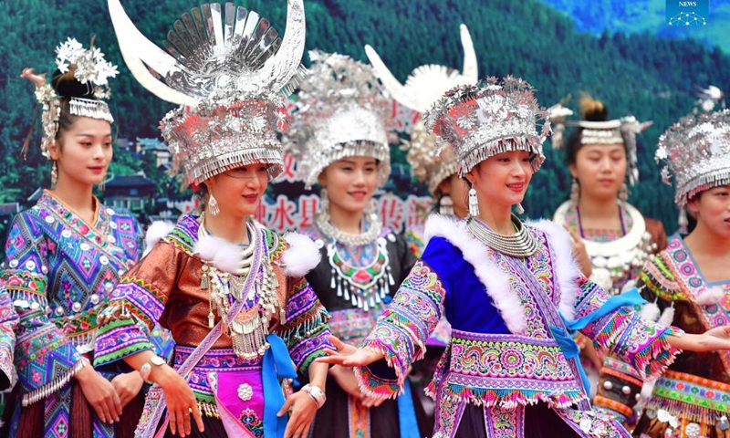 Women of the Miao ethnic group perform during an event celebrating the harvest season in Rongshui Miao Autonomous County, south China's Guangxi Zhuang Autonomous Region, Oct. 15, 2021.(Photo: Xinhua)