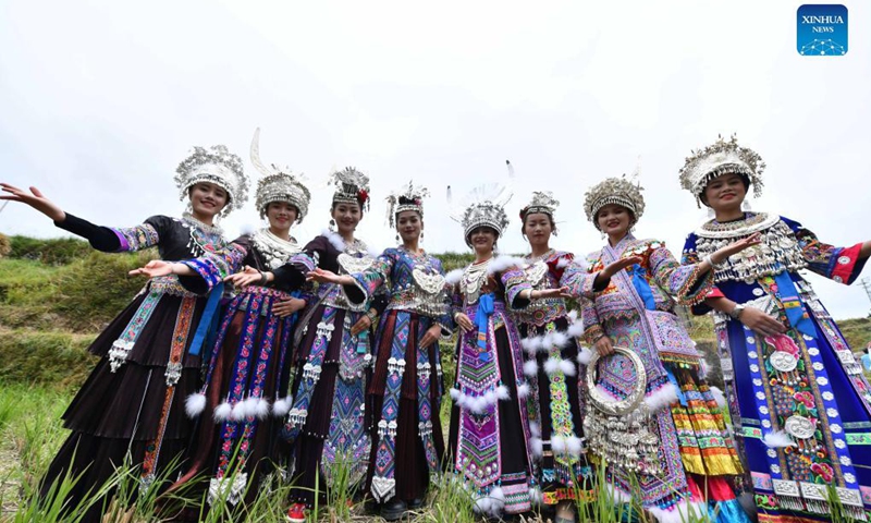 Women of the Miao ethnic group show their costumes during an event celebrating the harvest season in Rongshui Miao Autonomous County, south China's Guangxi Zhuang Autonomous Region, Oct. 15, 2021.(Photo: Xinhua)