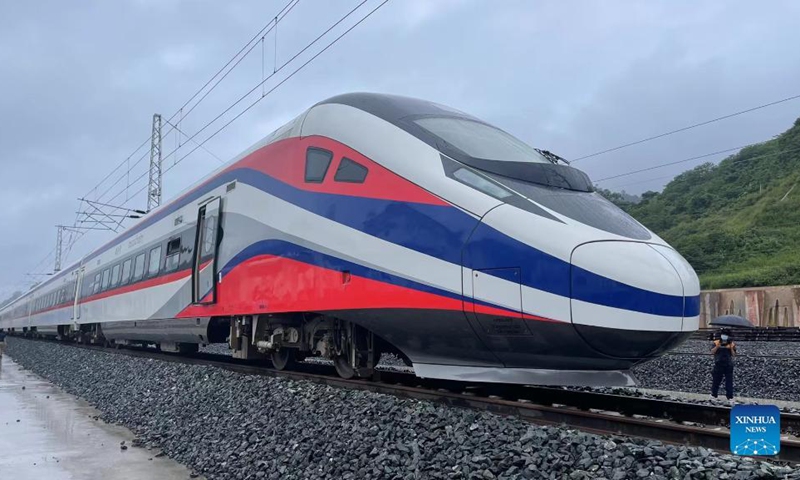 The Lane Xang EMU train arrives at the northern Laos' border town of Boten, after passing by the China-Laos borderline, Oct. 15, 2021. The streamlined China-standard bullet train, or electric multiple unit (EMU) train, for the China-Laos railway arrived at the newly built China-Laos Railway Vientiane Station on Saturday.(Photo: Xinhua)