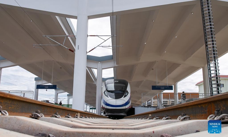 The Lane Xang EMU train arrives at the China-Laos railway Vientiane station in the Lao capital Vientiane, Oct. 16, 2021. The streamlined China-standard bullet train, or electric multiple unit (EMU) train, for the China-Laos railway arrived at the newly built China-Laos Railway Vientiane Station on Saturday.(Photo: Xinhua)