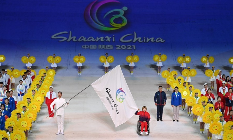 Representative of athletes Dong Feixia (R, front) takes the oath during the opening ceremony of the 11th National Games for Persons with Disabilities and the 8th National Special Olympics in Xi'an, Shaanxi Province, Oct. 22, 2021.Photo:Xinhua