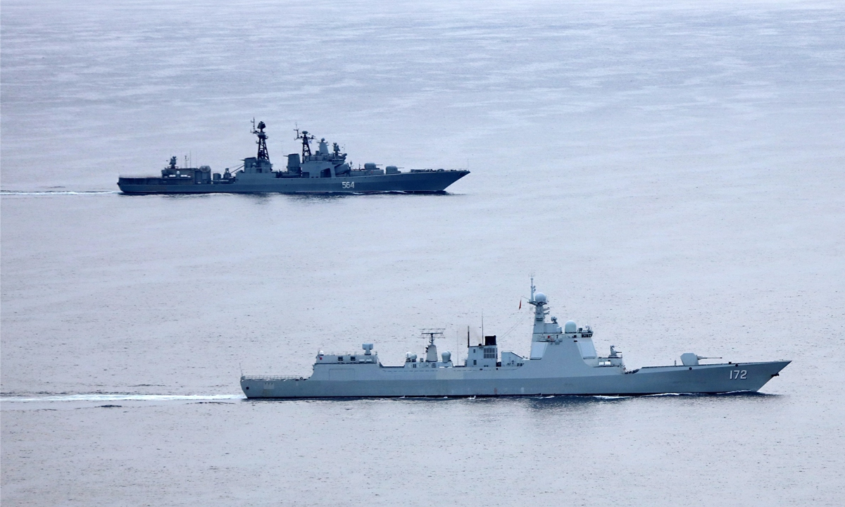 Chinese PLA navy’s destroyer Kunming sails with Russia’s large anti-submarine ship Admiral Tributs in the West Pacific on October 19, 2021. Photo: Li Tang