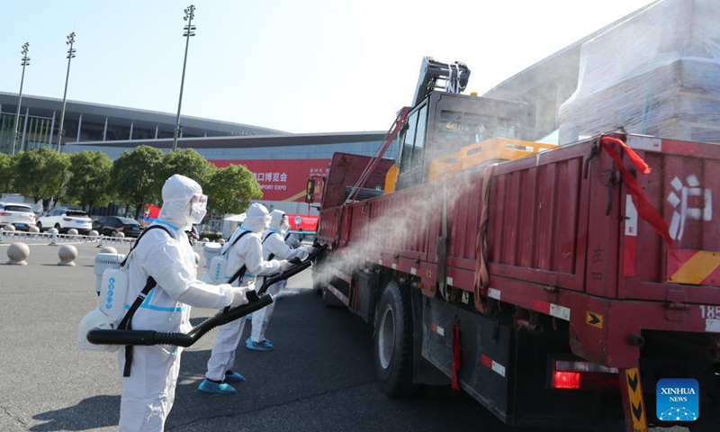 The first batch of exhibits are disinfected before entering the National Exhibition and Convention Center (Shanghai), a main venue for the fourth China International Import Expo (CIIE), in east China's Shanghai, Oct. 23, 2021. The expo is set to take place in Shanghai from Nov. 5 to 10 this year. (Photo: Xinhua)