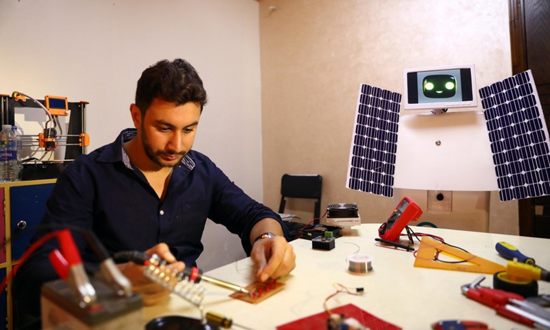 Egyptian mechatronics engineer Mahmoud El-Komy works at his office in Tanta city, northern Egypt, on Oct. 11, 2021. (Photo: Xinhua)