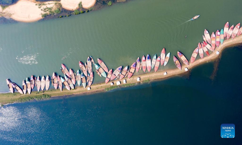 Aerial photo taken on Oct. 24, 2021 shows a view of boats loaded with stones on the Jadukata river in Sunamganj, Bangladesh. (Photo: Xinhua)