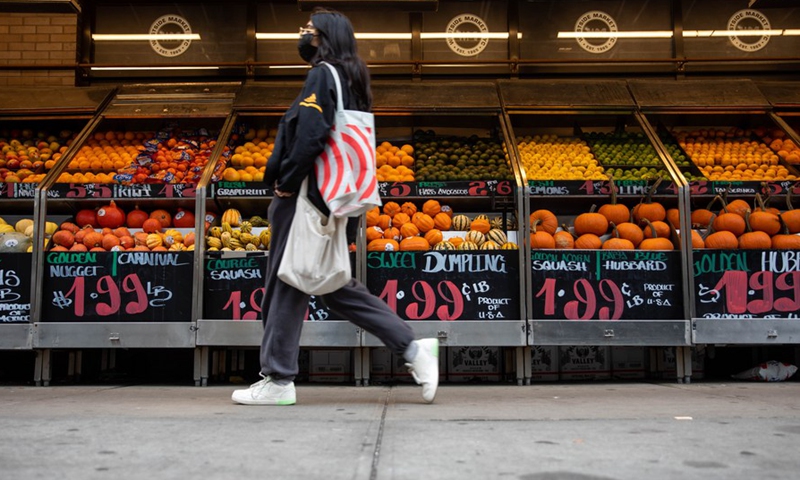 A pedestrian walks past a Westside Market in New York, the United States, on Oct. 13, 2021.(Photo: Xinhua)