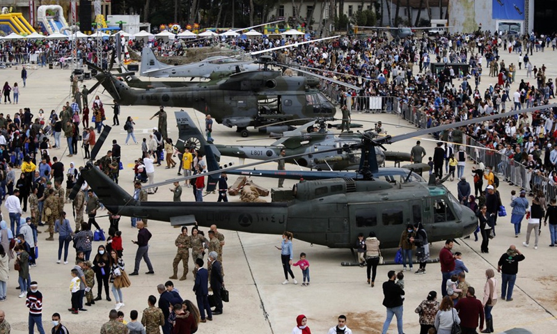 People look at military aircraft during an open day at Rayak Air Base in Bekaa, Lebanon, on Oct. 31, 2021.(Photo: Xinhua)