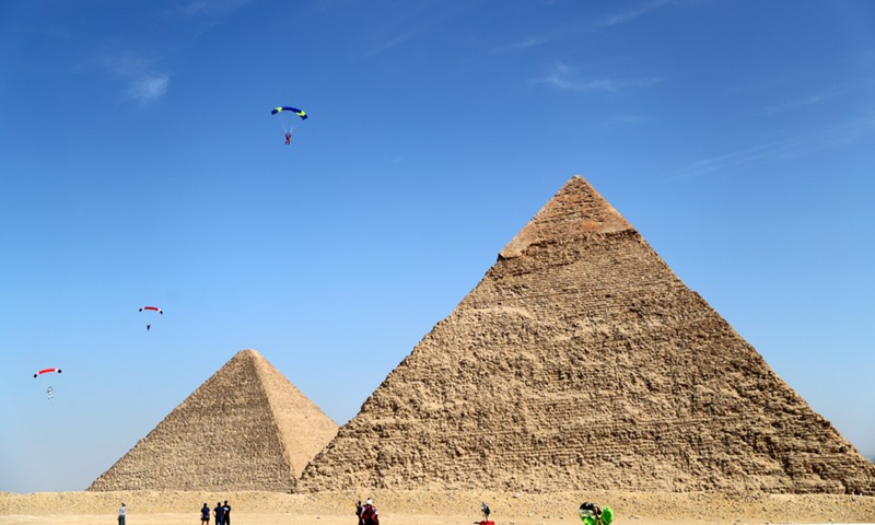 Skydivers fly over the pyramids during the Jump Like a Pharaoh skydiving festival held in the Pyramids of Giza, Egypt, on Nov. 1, 2021.(Photo: Xinhua)