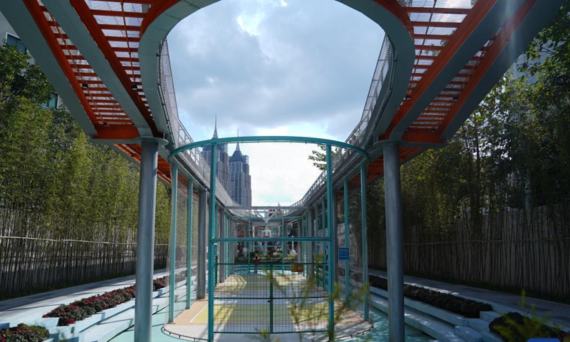 Photo taken on Oct. 31, 2021 shows a basketball court in the Baixi Park in Putuo District of Shanghai, east China. Transformed from a market built on an old railway branch line, the Baixi Park is now a city park which provides citizens with space for exercise and entertainment.(Photo: Xinhua)