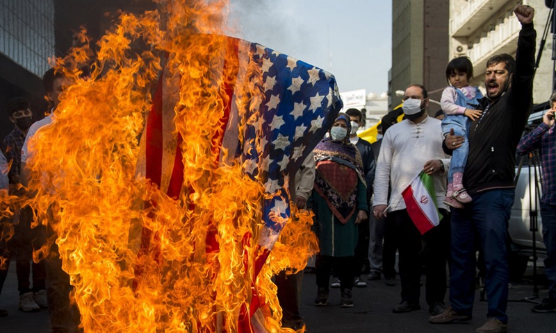 Demonstrators burn a U.S. flag during a rally marking the 42nd anniversary of seizing the U.S. embassy in Tehran, Iran, on Nov. 4, 2021.(Photo: Xinhua)