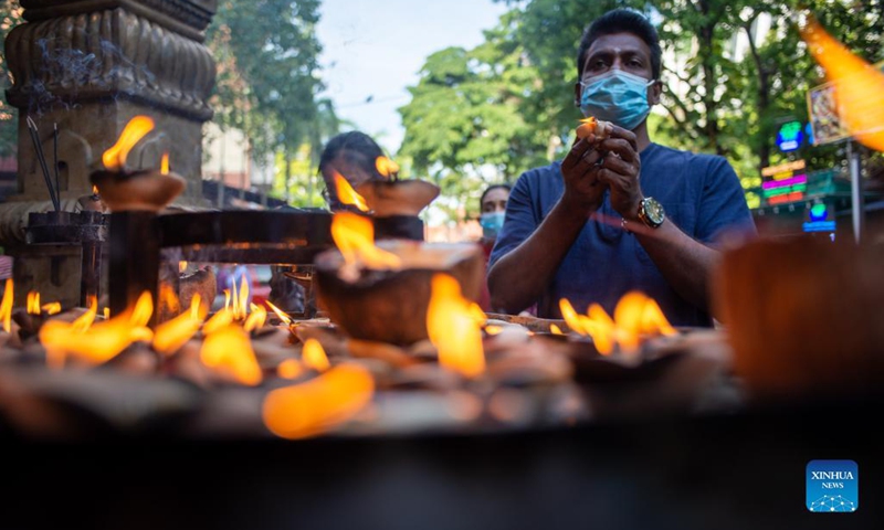 A man prays at a temple on the occasion of Hindu festival Deepavali in Kuala Lumpur, Malaysia, Nov. 4, 2021.(Photo: Xinhua)