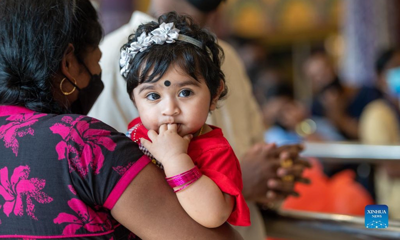 A child is seen during celebrations of Hindu festival Deepavali at a temple in Kuala Lumpur, Malaysia, Nov. 4, 2021.(Photo: Xinhua)