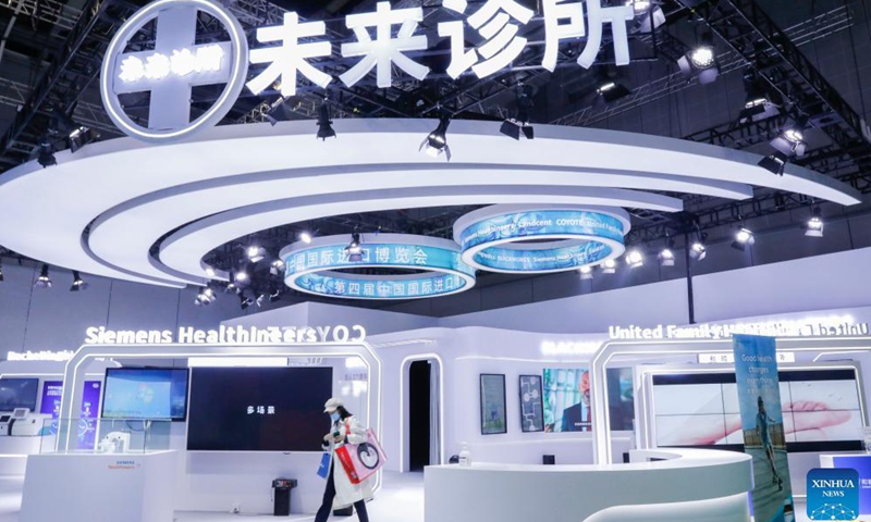A visitor walks past a booth at the Medical Equipment and Healthcare Products Exhibition Area of the 4th China International Import Expo (CIIE) in east China's Shanghai, Nov. 6, 2021.Photo:Xinhua