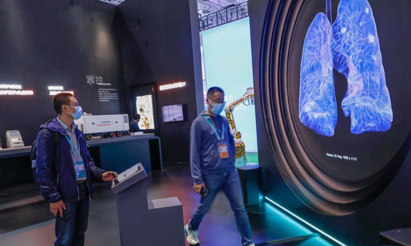 A visitor experiences an interactive equipment at the Medical Equipment and Healthcare Products Exhibition Area of the 4th China International Import Expo (CIIE) in east China's Shanghai, Nov. 6, 2021.Photo:Xinhua