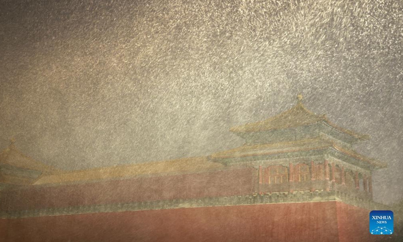 Photo taken on Nov. 6, 2021 shows the Palace Museum amid falling snow in Beijing, capital of China. Heavy snowfall swept Beijing on Saturday and brought low temperatures.Photo:Xinhua