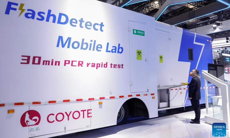 A staff member demonstrates a mobile laboratory for PCR tests at the Medical Equipment and Healthcare Products Exhibition Area of the 4th China International Import Expo (CIIE) in east China's Shanghai, Nov. 6, 2021.Photo:Xinhua
