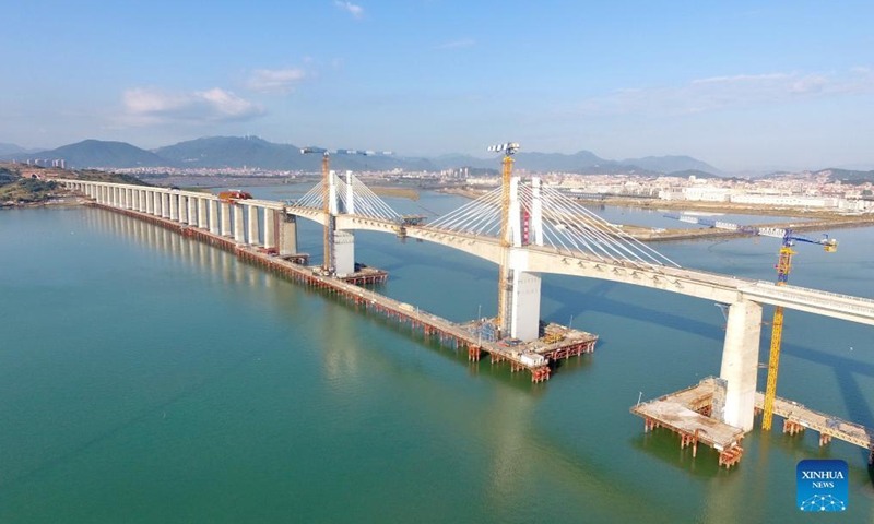 Aerial photo taken on Nov. 13, 2021 shows a view of the Meizhou Bay cross-sea bridge under construction, as a part of the Fuzhou-Xiamen high-speed railway, in southeast China's Fujian Province.Photo:Xinhua
