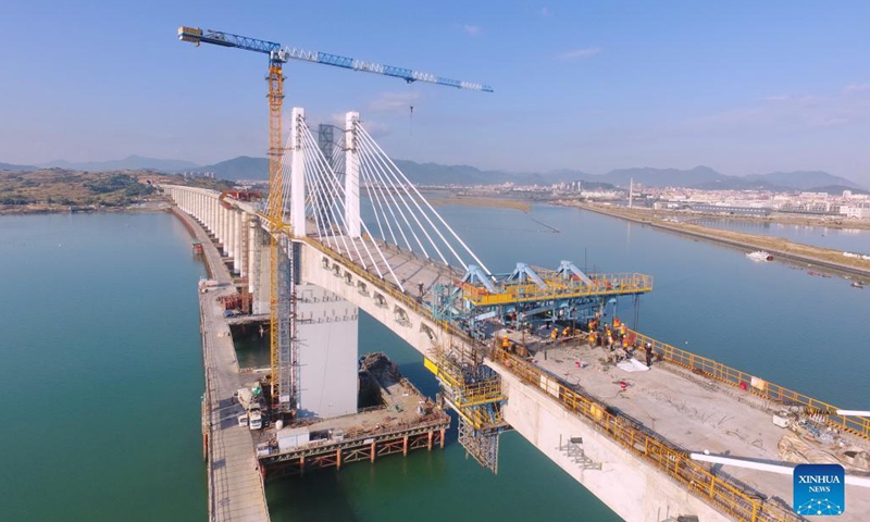 Aerial photo taken on Nov. 13, 2021 shows a view of the Meizhou Bay cross-sea bridge under construction, as a part of the Fuzhou-Xiamen high-speed railway, in southeast China's Fujian Province.Photo:Xinhua