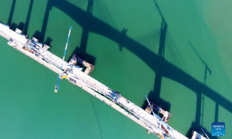 Aerial photo taken on Nov. 13, 2021 shows a view of the Meizhou Bay cross-sea bridge under construction, as a part of the Fuzhou-Xiamen high-speed railway, in southeast China's Fujian Province.Photo:Xinhua