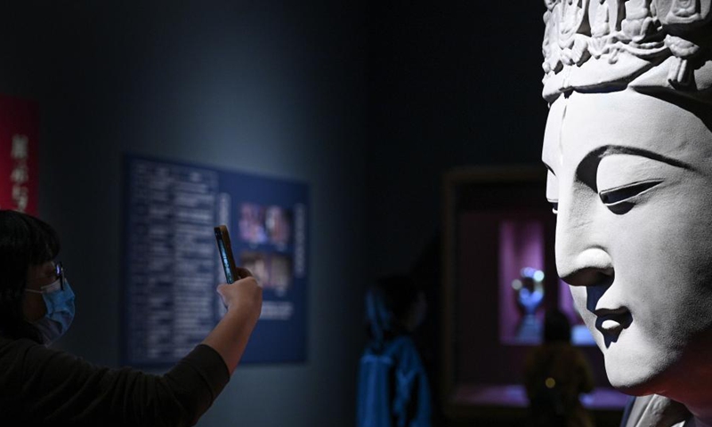 A visitor takes photos of an exhibit at the National Museum of China in Beijing, capital of China, Nov. 13, 2021.Photo:Xinhua