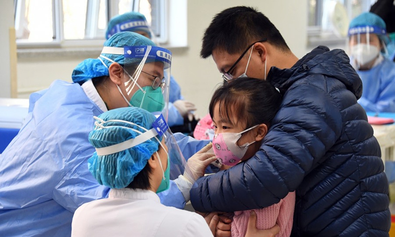 A child receives a dose of COVID-19 vaccine in the Xueyuanlu subdistrict of Haidian District, Beijing, capital of China, Nov. 13, 2021.Photo:Xinhua