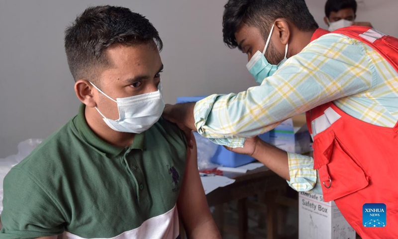 A man receives a dose of COVID-19 vaccine at a slum in Dhaka, Bangladesh, Nov. 16, 2021. (Xinhua) 