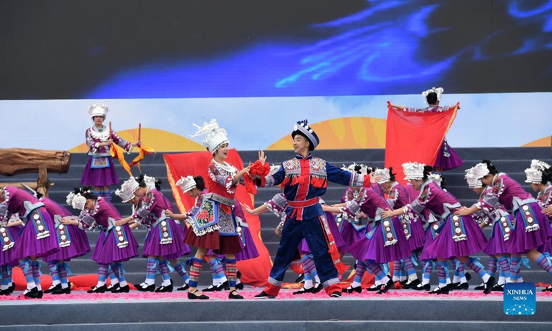 People perform to celebrate the 70th anniversary of the founding of Longsheng County in Longsheng County, south China's Guangxi Zhuang Autonomous Region, Nov. 19, 2021. A celebration event was held in Longsheng on Friday, marking the 70th anniversary of the founding of the autonomous county resided by people of various ethnic groups. (Xinhua/Lu Boan)