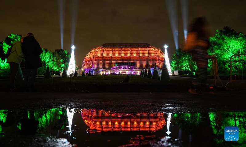 A building is illuminated during the Christmas Garden Berlin light show at Berlin-Dahlem Botanical Garden in Berlin, capital of Germany, Nov. 19, 2021. The Christmas Garden Berlin kicked off on Friday and will last until Jan. 9, 2022. (Photo by Stefan Zeitz/Xinhua)