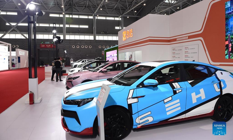 People view new energy vehicles on display at the fourth World Manufacturing Convention in Hefei, east China's Anhui Province, Nov. 19, 2021. The fourth World Manufacturing Convention kicked off Friday in Hefei, capital of east China's Anhui Province. The four-day event, themed innovation-driven, digitally empowered: global manufacturing industry aligned for high-quality growth, aims to promote high-quality manufacturing and deepen exchanges between China and the rest of the world. (Xinhua/Huang Bohan)