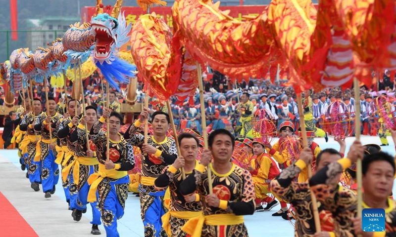 People perform to celebrate the 70th anniversary of the founding of Longsheng County in Longsheng County, south China's Guangxi Zhuang Autonomous Region, Nov. 19, 2021. A celebration event was held in Longsheng on Friday, marking the 70th anniversary of the founding of the autonomous county resided by people of various ethnic groups. (Xinhua/Lu Boan)