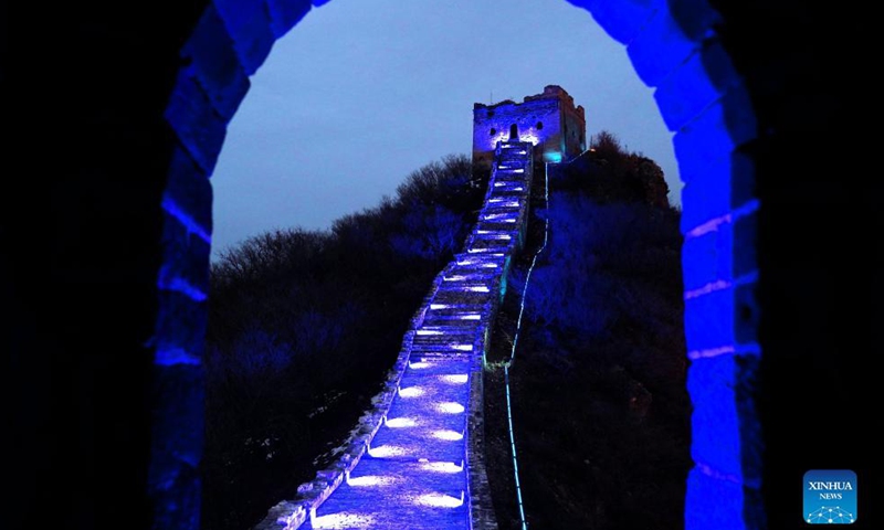 The Simatai section of the Great Wall is lit up blue to celebrate World Children's Day in Beijing, capital of China, Nov. 20, 2021.Photo:Xinhua