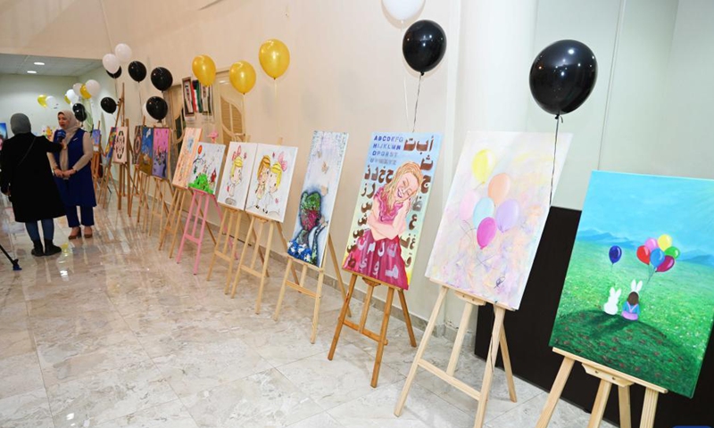 People visit an exhibition of artistic paintings for children in Hawalli Governorate, Kuwait, on Nov. 22, 2021.Photo:Xinhua