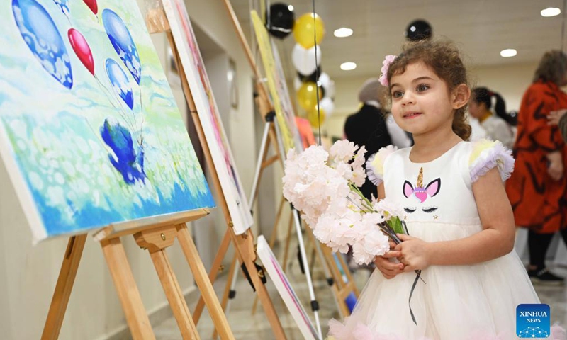 A girl looks at exhibits during an exhibition of artistic paintings for children in Hawalli Governorate, Kuwait, on Nov. 22, 2021.Photo:Xinhua