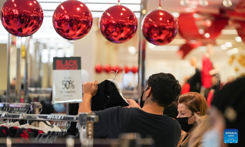 People shop at Macy's Herald Square store during Black Friday in New York, the United States, Nov 26, 2021.Photo:Xinhua