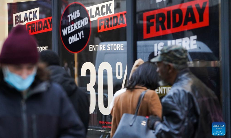 People shop at Macy's Herald Square store during Black Friday in New York, the United States, Nov 26, 2021.Photo:Xinhua