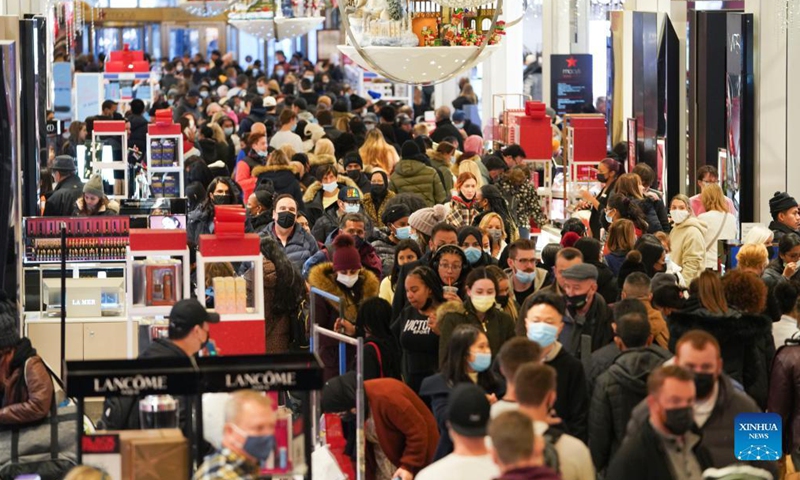 People shop at Macy's Herald Square store during Black Friday in New York, the United States, Nov 26, 2021.Photo:Xinhua