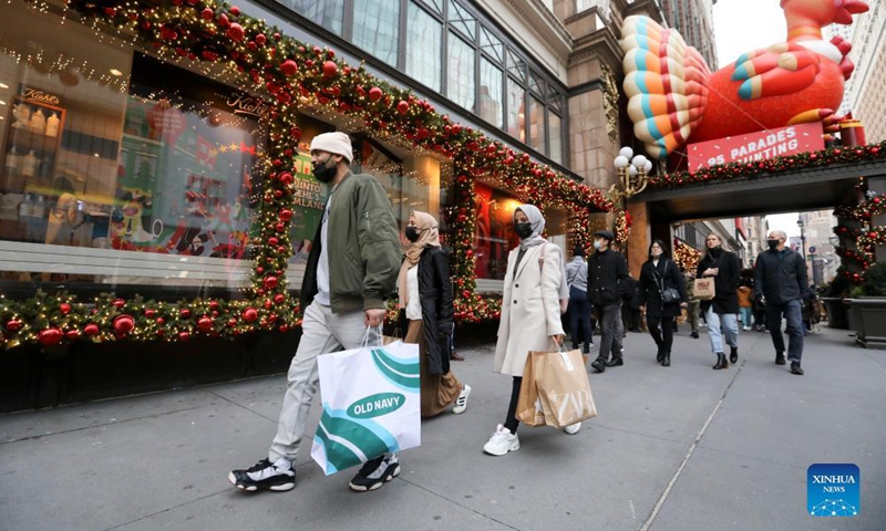 People shop at Macy's Herald Square store during Black Friday in New York, the United States, Nov 26, 2021.Photo:Xinhua
