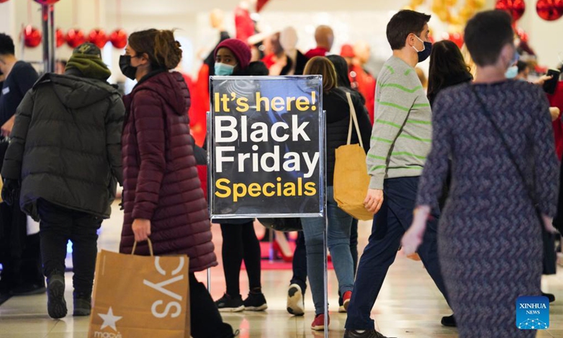 People shop at Macy's Herald Square store during Black Friday in New York, the United States, Nov 26, 2021.Photo:Xinhua