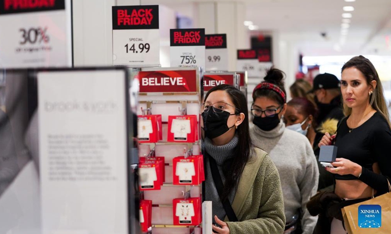 People shop at Macy's Herald Square store during Black Friday in New York, the United States, Nov 26, 2021.Photo:Xinhua