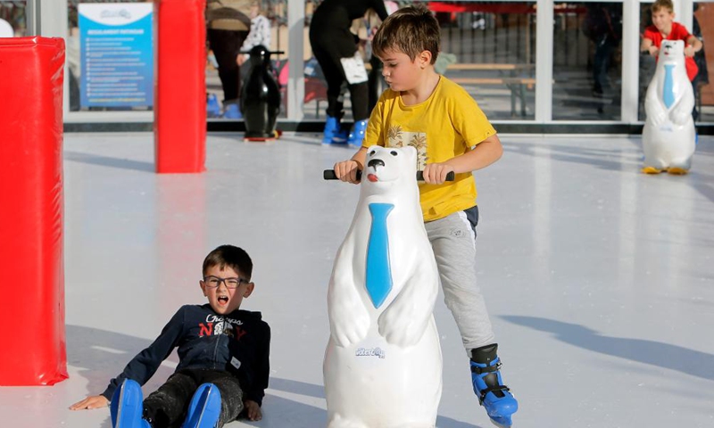Children enjoy ice skating in Bucharest, Romania, Nov. 27, 2021.Photo:Xinhua