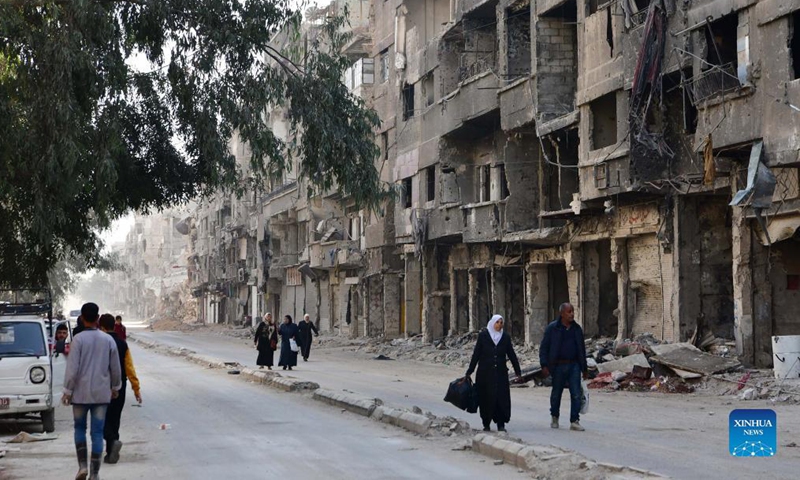 People walk at the Yarmouk Camp in the south of Damascus, Syria, on Nov. 17, 2021.Photo:Xinhua